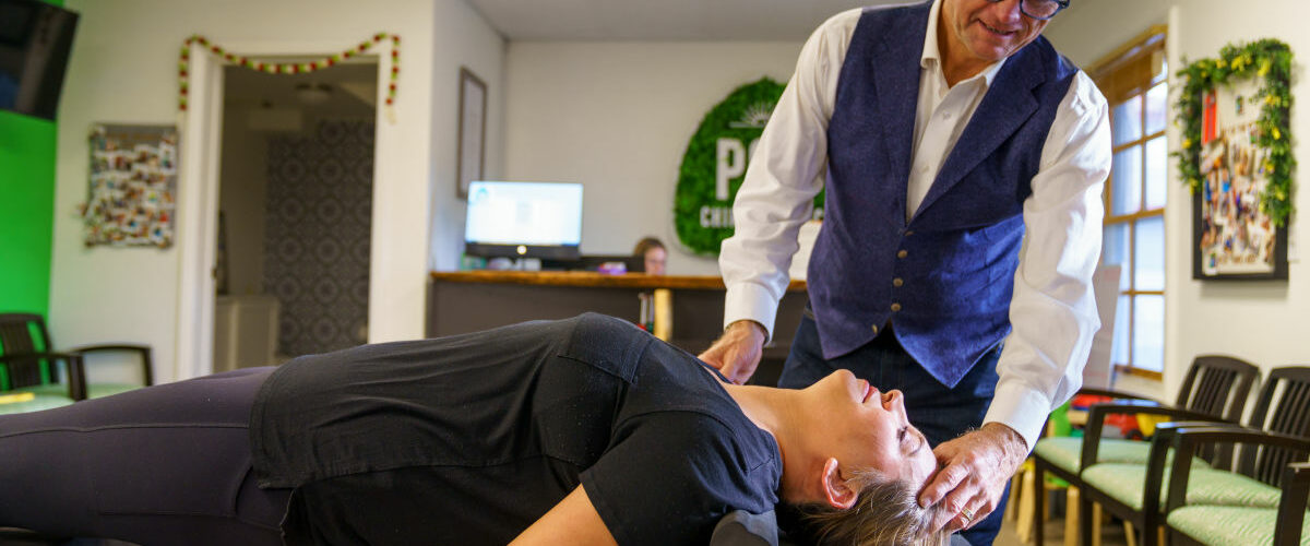 patient getting help from a chiropractor for their spinal health