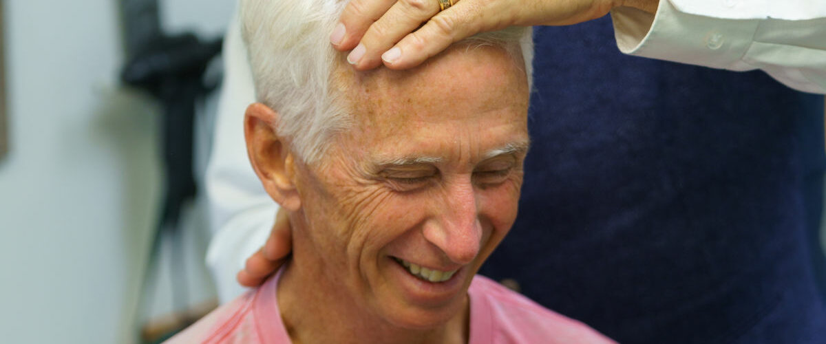 a man receiving chiropractic care for his concussion condition