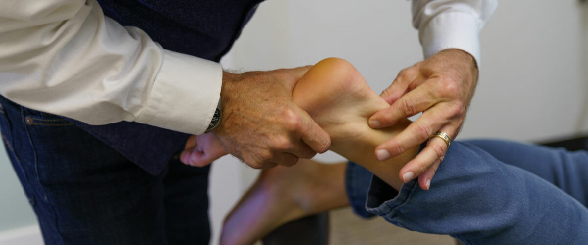 chiropractic doctor providing an adjustment to a patient